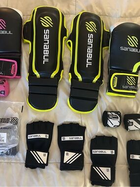 Sanabul Boxing Gloves & Shin Gaurds package.